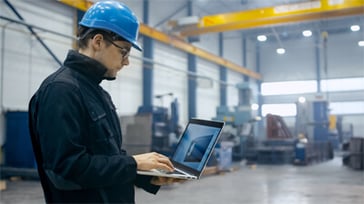 Maintenance_Worker_With_LaptopMaintenance_Worker_With_Laptop